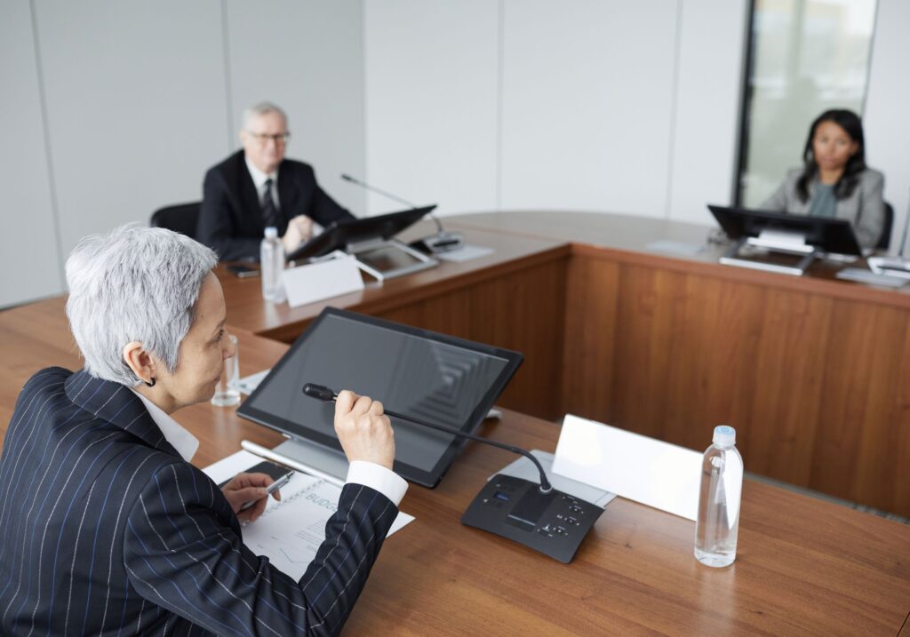 Senior executives in a formal boardroom meeting